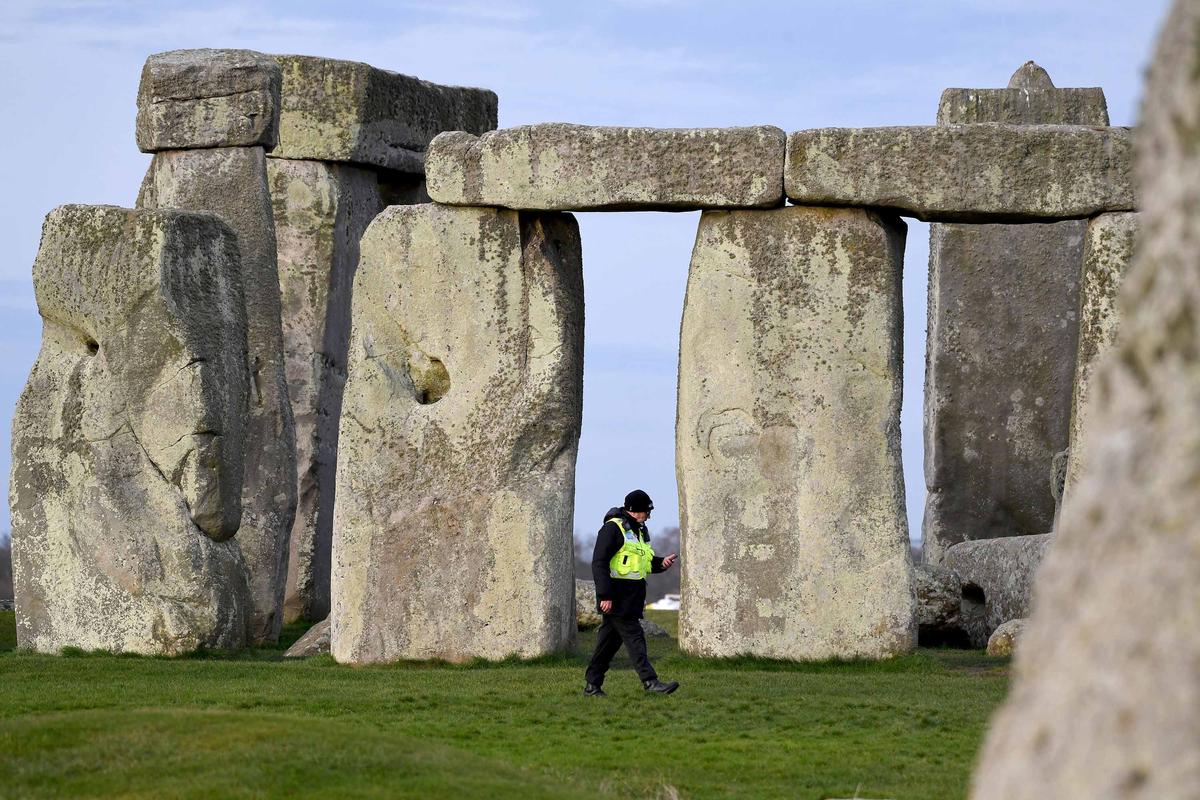A security guard patrols around closed Stonehenge on March 20, 2020, in Amesbury, United Kingdom. (Finnbarr Webster/Getty Images)
