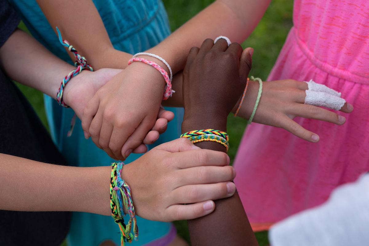 Kamryn and friends wearing friendship bracelets they made. (Courtesy of Jamie Stoia)