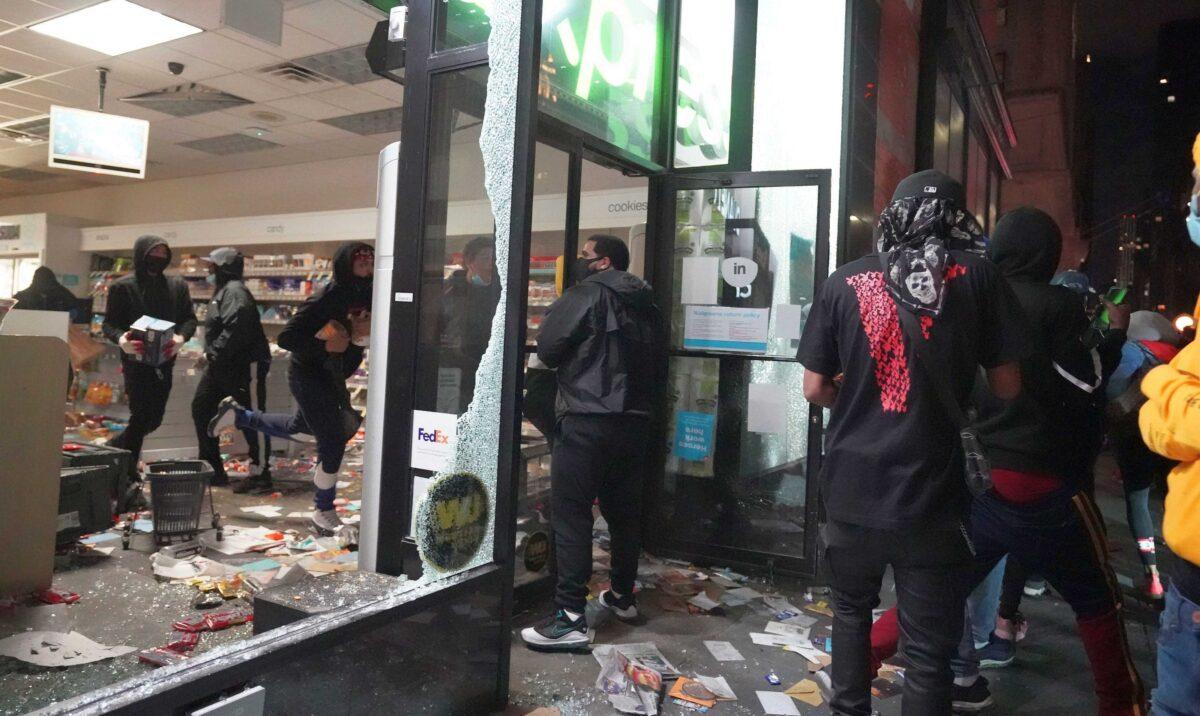 People loot a store during demonstrations over the death of George Floyd by a Minneapolis police officer, in New York on June 1, 2020. (Bryan R. Smith/AFP via Getty Images)
