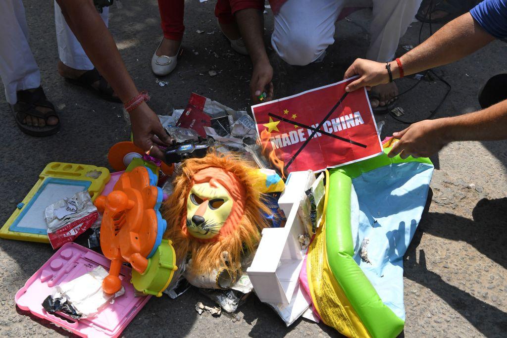 Anti-China protesters prepare to burn Chinese products while urging citizens to boycott Chinese goods during a demonstration in New Delhi on June 18, 2020. (Prakash Singh/AFP/Getty Images)