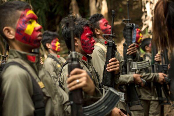 Guerrillas of the New People's Army in formation in the Sierra Madre mountain range, located east of Manila, the Philippines, on July 30, 2017. (Noel Celis/AFP via Getty Images)