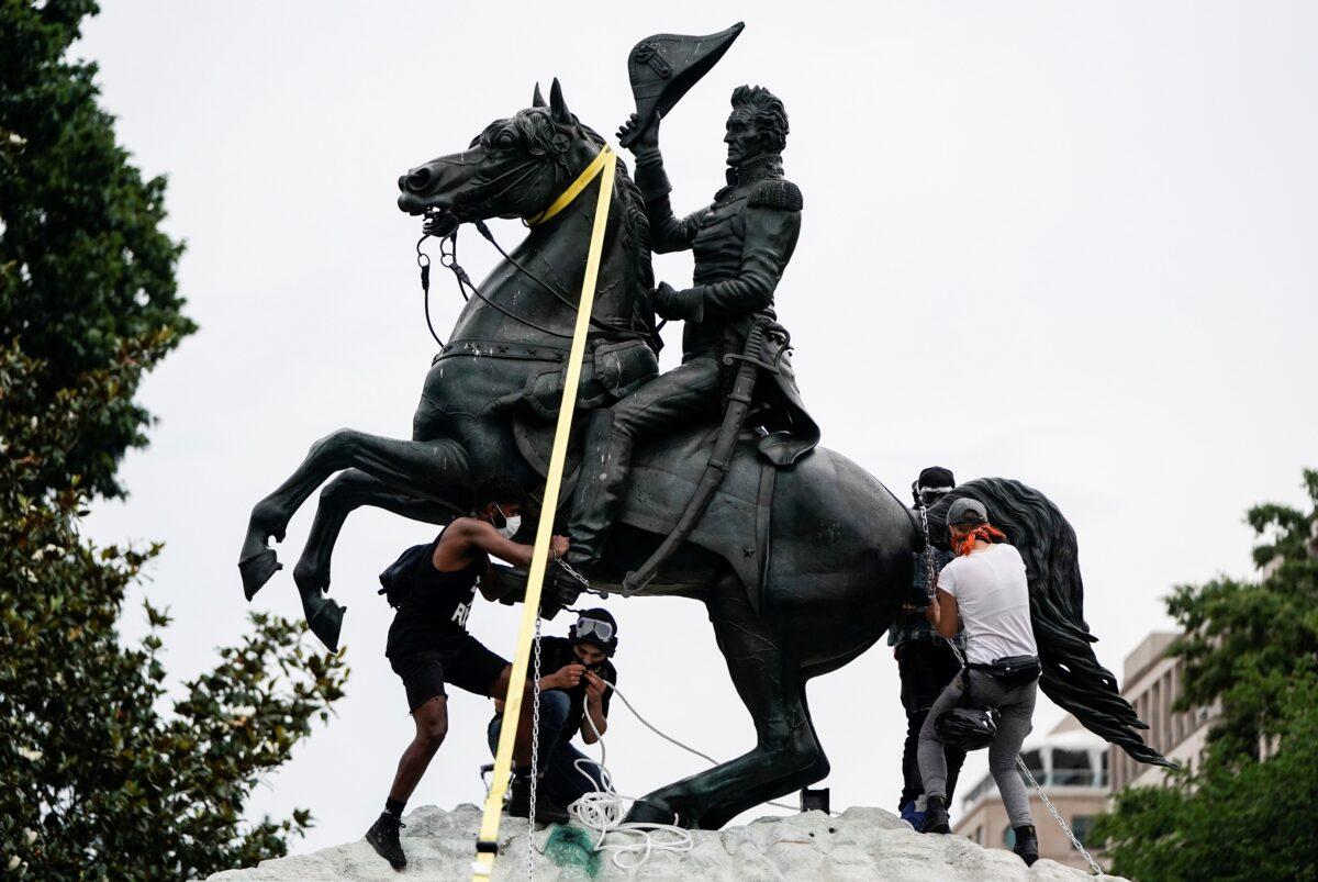 Vandals attempt to pull down the statue of former President Andrew Jackson in the middle of Lafayette Park in front of the White House during racial inequality protests in Washington on June 22, 2020. (Joshua Roberts/Reuters)