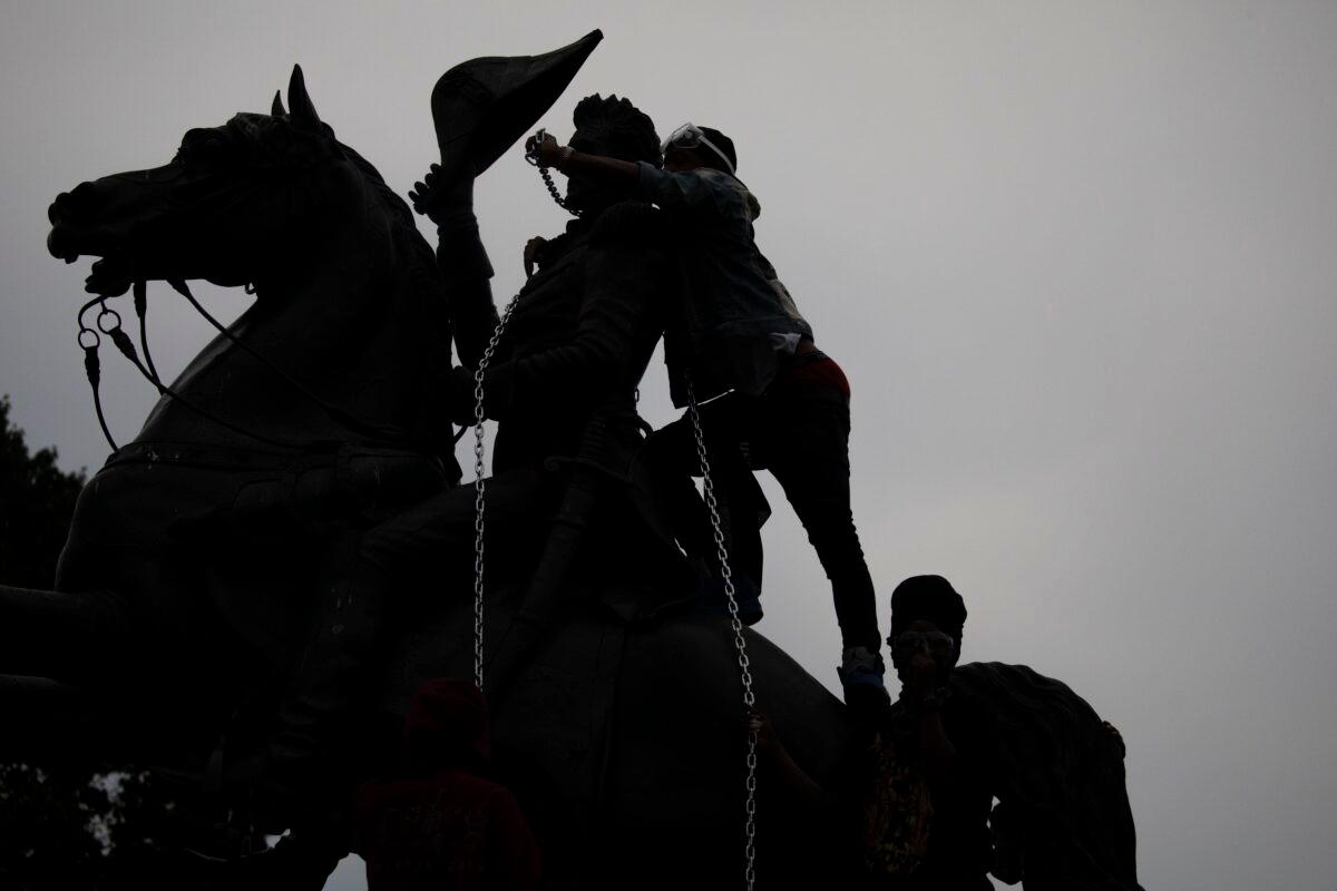 Vandals attempt to pull down the statue of Andrew Jackson in Lafayette Square near the White House in Washington on June 22, 2020. (Tasos Katopodis/Getty Images)