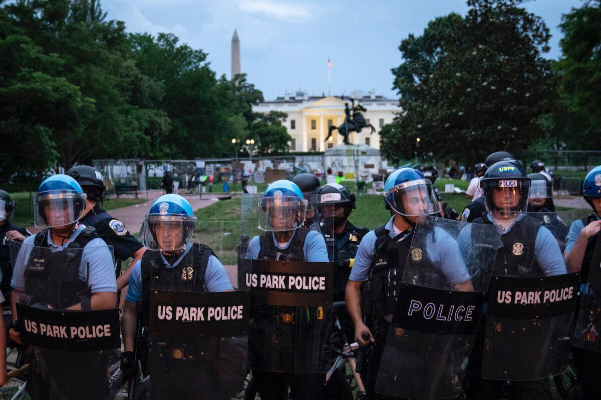 U.S. Park Police keep crowds back after some among them attempted to pull down the statue of Andrew Jackson in Lafayette Square near the White House in Washington, on June 22, 2020. (Drew Angerer/Getty Images)