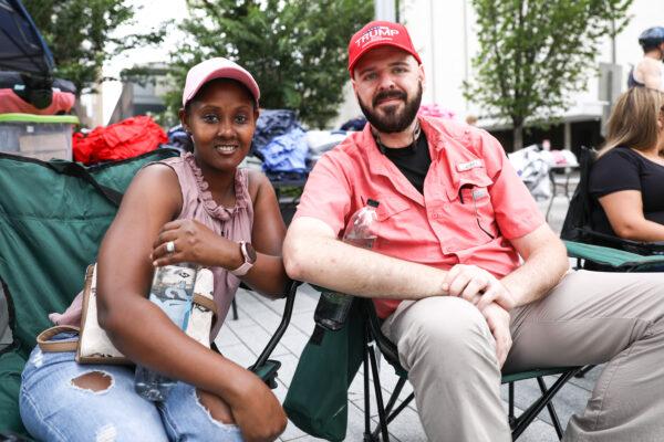 Fatima and Seth wait in line before a campaign rally for President Donald Trump at the BOK Center in Tulsa, Okla., on June 20, 2020. (Charlotte Cuthbertson/The Epoch Times)