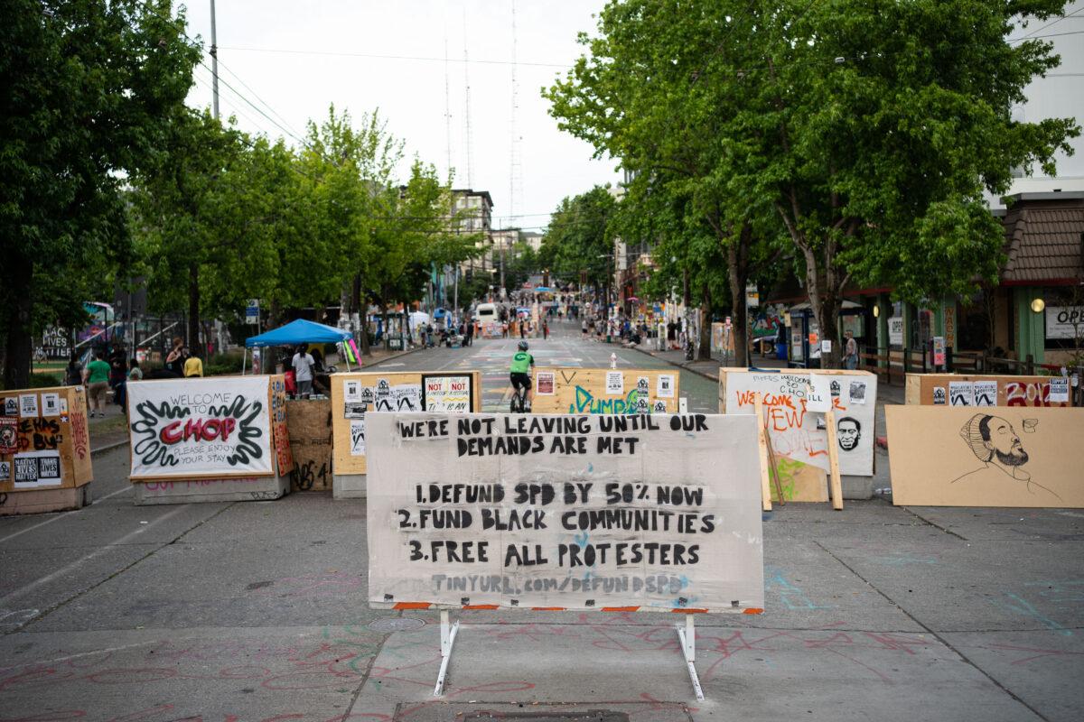 A message stating demands is posted an entrance to the area known as the Capitol Hill Organized Protest (CHOP) in Seattle, Wash. on June 23, 2020. (David Ryder/Getty Images)