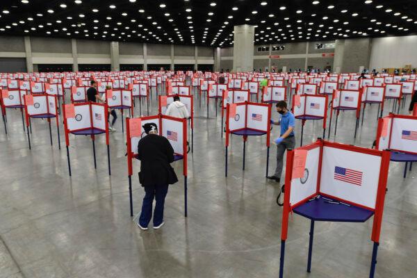 Voting stations are set up in the South Wing of the Kentucky Exposition Center for voters to cast their ballot in the Kentucky primary in Louisville, Ky., on June 23, 2020. (AP Photo/Timothy D. Easley)