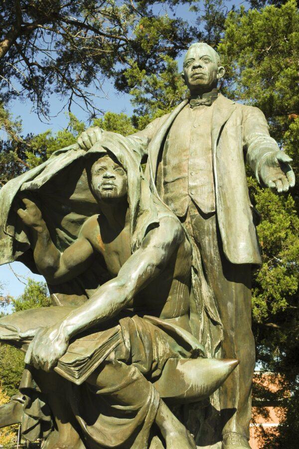 "Lifting the Veil of Ignorance," a statue of Booker T. Washington at Tuskegee University. (Jeffrey M. Frank/ Shutterstock)