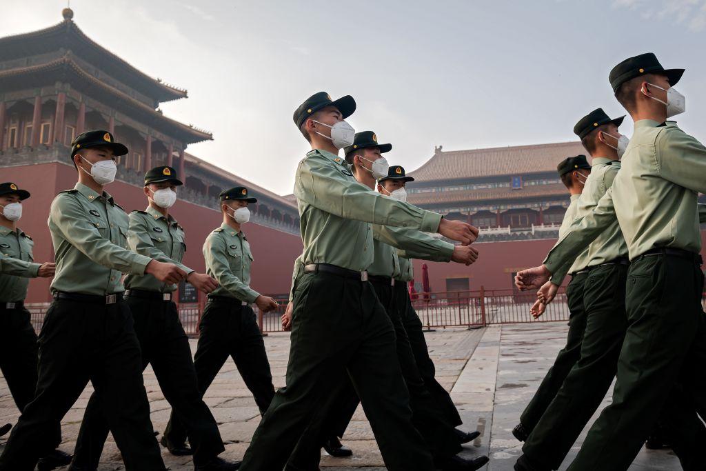 People's Liberation Army soldiers march next to the entrance to the Forbidden City during the opening ceremony of the Chinese People's Political Consultative Conference in Beijing on May 21, 2020. (Nicolas Asfouri/AFP via Getty Images)