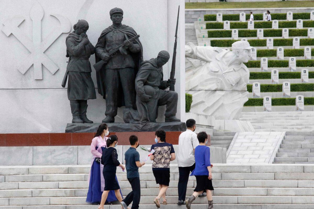 North Koreans visit the Fatherland Liberation War Martyrs Cemetery to pay respects to the monument to the fallen soldiers of the Korean People's Army in Pyongyang, North Korea, on June 25, 2020. (Jon Chol Jin/AP Photo)