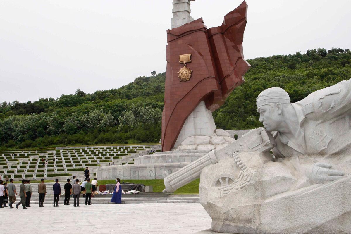 North Koreans visit the Fatherland Liberation War Martyrs Cemetery to pay respects to the monument to the fallen soldiers of the Korean People's Army in Pyongyang, North Korea, on June 25, 2020. (Jon Chol Jin/AP Photo)