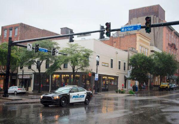 A police car drives through an intersection in this file photo taken in Wilmington, N.C. (Andrew Caballero/AFP/Getty Images)