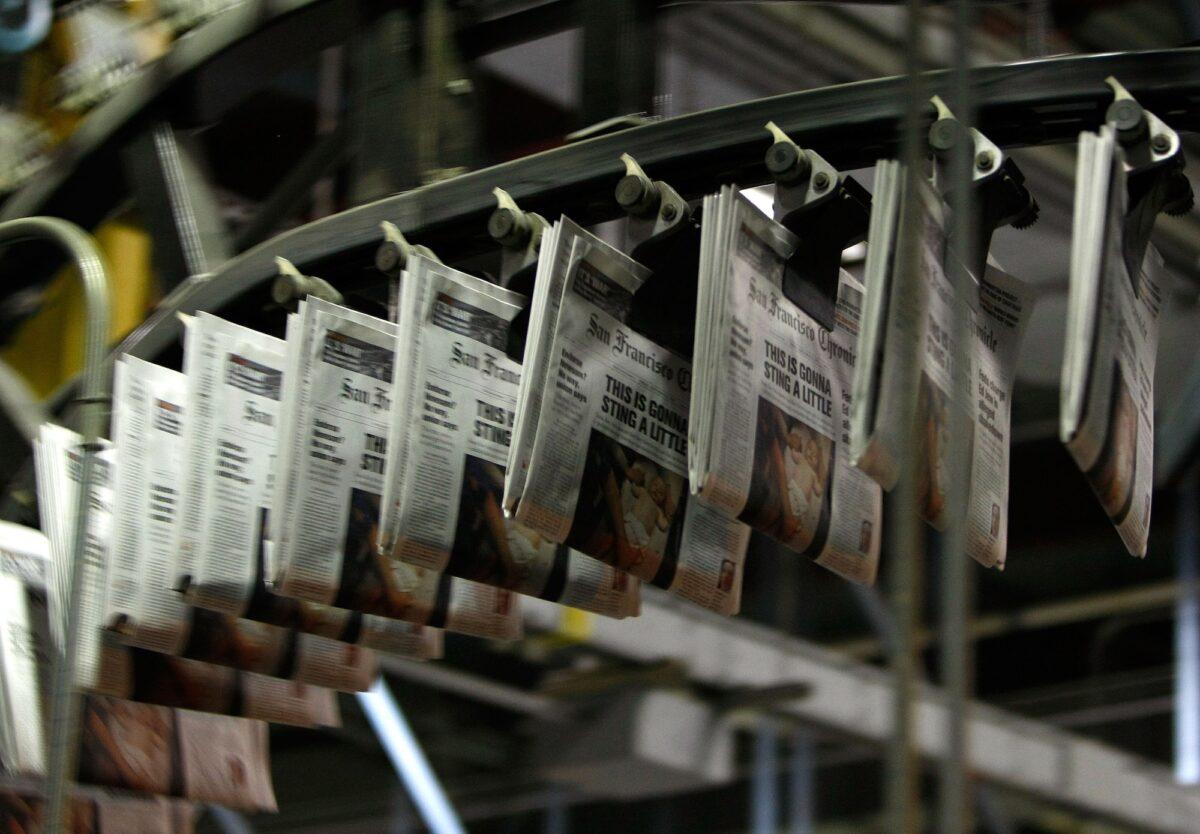 Freshly printed copies of the San Francisco Chronicle roll off the printing press at one of the Chronicle's printing facilities in San Francisco, Cali., on Sept. 20, 2007. (Justin Sullivan/Getty Images)