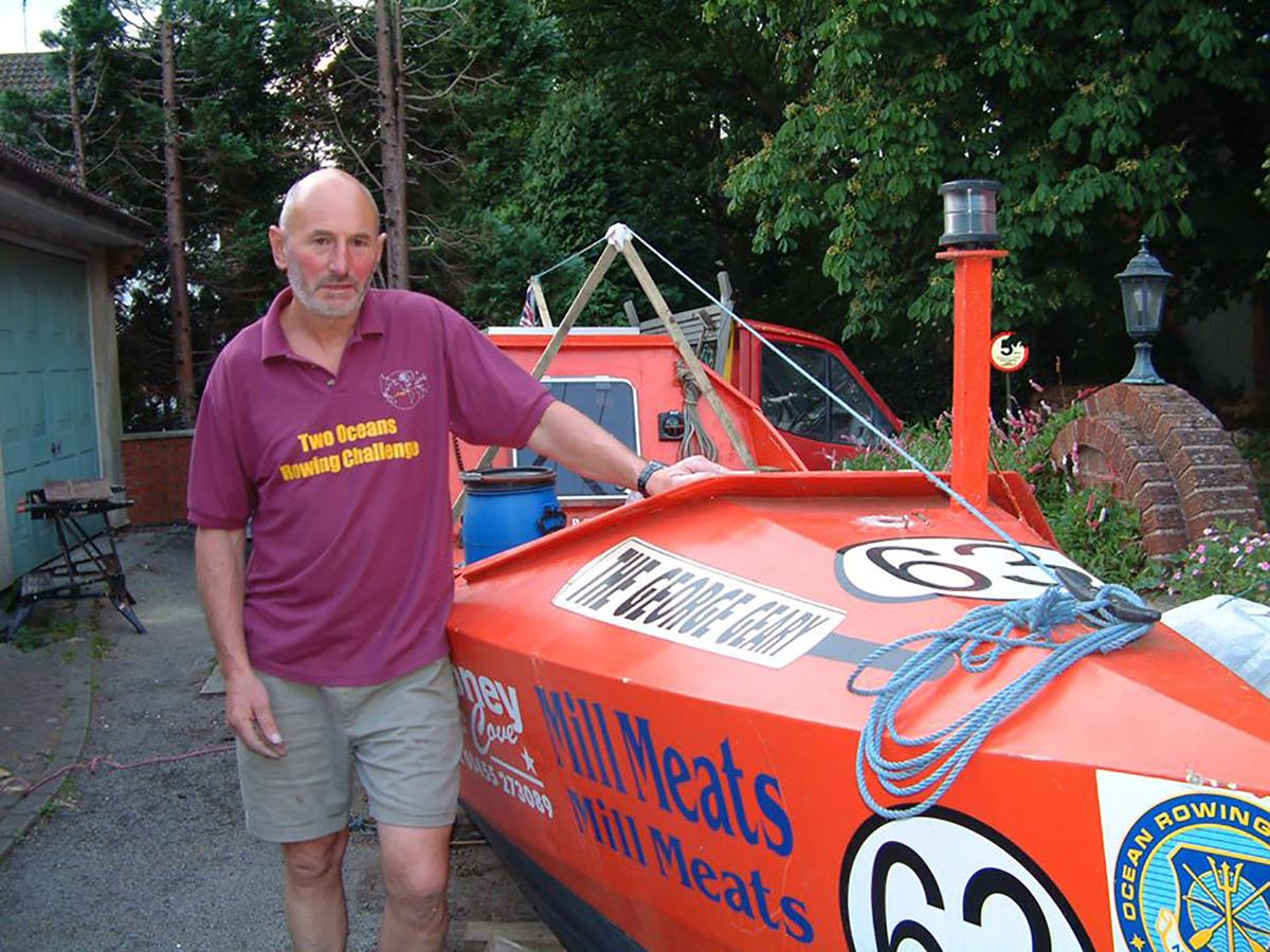 Walters poses with his boat before setting off to break the record. (Courtesy of Graham Walters)