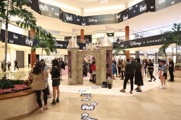 A crowd gathers inside South Coast Plaza, the largest shopping mall in California, in Costa Mesa, Calif., on May 15, 2018. (Ryan Miller/Getty Images for Coach)