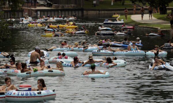 Tubers float the Comal River despite the recent spike in COVID-19 cases on June 25, 2020, in New Braunfels, Texas. (AP Photo/Eric Gay)