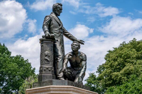 Activists now are calling for the removal of the Emancipation Memorial in Washington's Lincoln Park, shown here on June 25, 2020,  which depicts a freed slave kneeling at the feet of President Abraham Lincoln. (J. Scott Applewhite/AP Photo)
