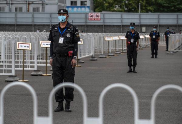 Chinese security are seen at a nucleic acid swab test government site for COVID-19 in Xicheng District during an organized tour on June 24, 2020 in Beijing, China. (Kevin Frayer/Getty Images)
