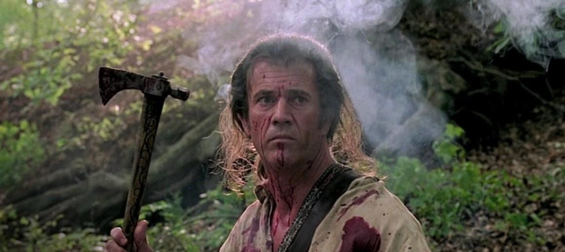 Benjamin Martin (Mel Gibson) about to fling a tomahawk, in "The Patriot." (Columbia Pictures)