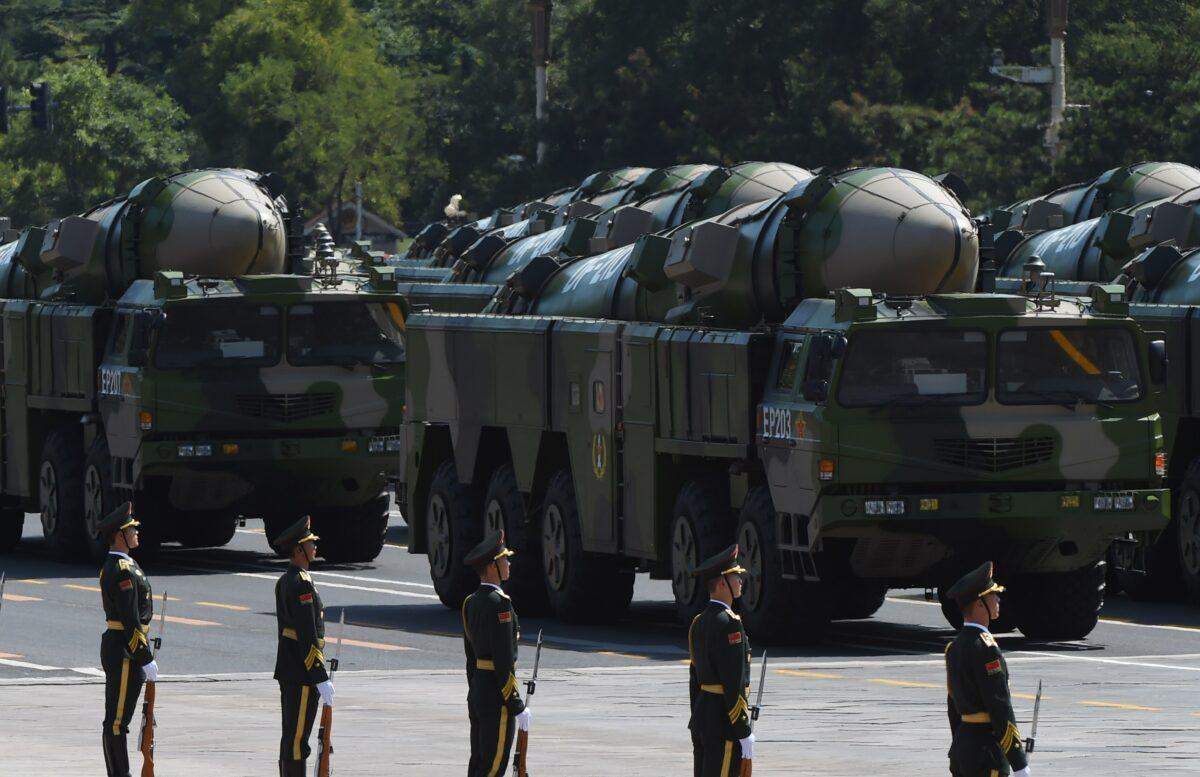 Chinese military vehicles carrying DF-21D anti-ship ballistic missiles drive past the Tiananmen Gate during a military parade to mark the 70th anniversary of the end of World War II in Beijing on Sept. 3, 2015. (Andy Wong/Pool/Getty Images)