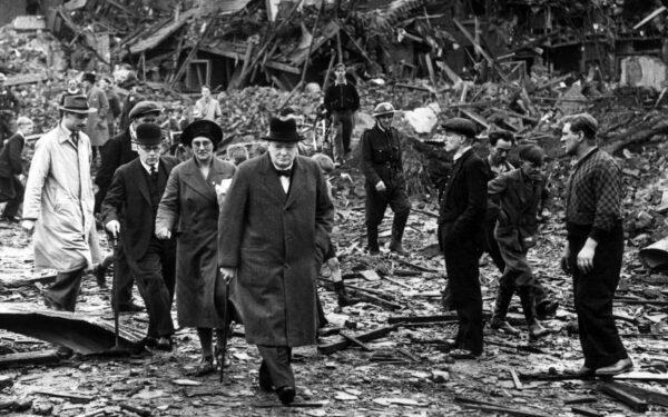 Prime Minister Winston Churchill inspects air raid damage in Battersea, south London, on Sept. 10, 1940. (Reg Speller/Fox Photos/Getty Images)