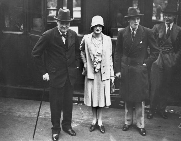 British statesman Winston Churchill at Waterloo Station, London, at the start of a trip to Canada with his son Randolph (2nd R) on Aug. 3, 1929. Seeing them off is Churchill's daughter, Diana. (Puttnam/Topical Press Agency/Hulton Archive/Getty Images)