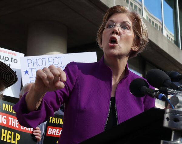 Sen. Elizabeth Warren (D-Mass.) speaks during a protest in front of the<br/>Consumer Financial Protection Bureau headquarters in Washington on Nov. 28, 2017. (Mark Wilson/Getty Images)