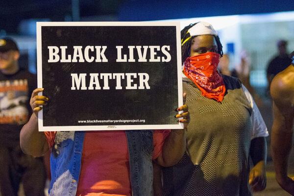 Demonstrators, marking the one-year anniversary of the shooting of Michael Brown, protest in Ferguson, Missouri, on August 10, 2015. (Scott Olson/Getty Images)