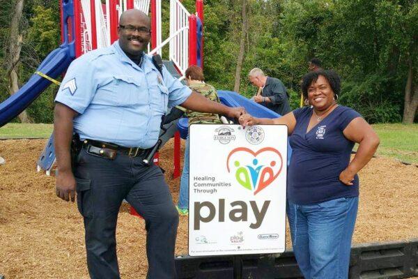 Kelli Lowe, president of National Police Wives Association, stands with her husband, Charles Lowe. Kelli Lowe has helped her community in St. Louis foster understanding between black youth and the police. (Courtesy of Kelli Lowe)