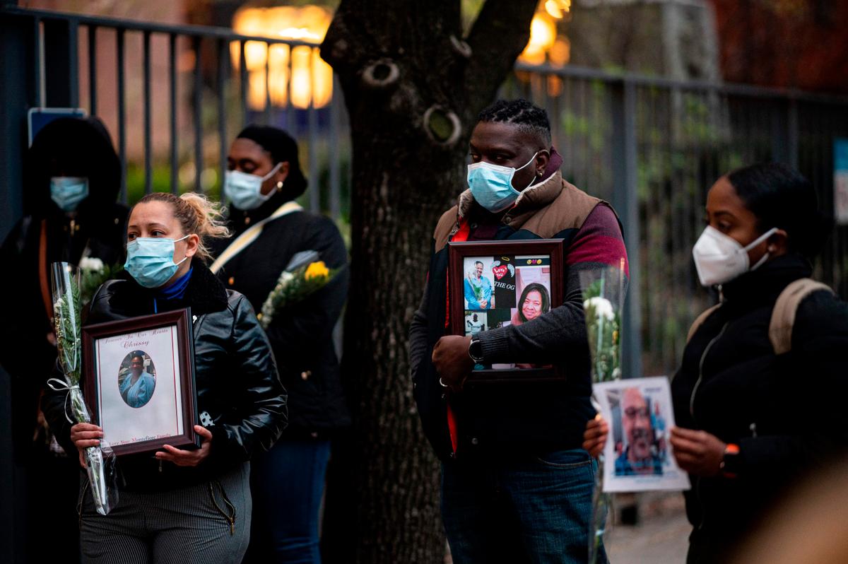 Health care workers mourn their colleagues during a demonstration outside Mount Sinai Hospital in Manhattan on April 10, 2020. (JOHANNES EISELE/AFP via Getty Images)