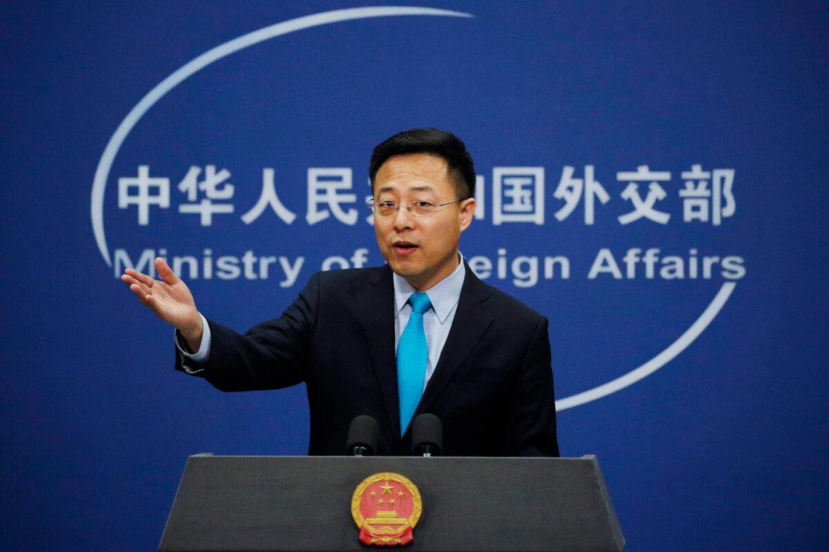  Chinese Foreign Ministry new spokesman Zhao Lijian gestures as he speaks during a daily briefing at the Ministry of Foreign Affairs office in Beijing on Feb. 24, 2020. (Andy Wong/AP Photo)