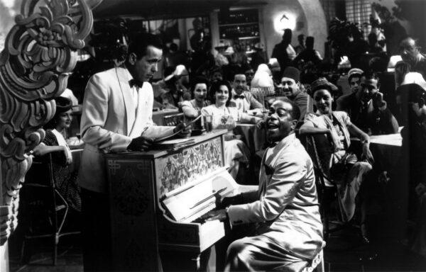 Rick (Humphrey Bogart, L) and Sam (Dooley Wilson) playing piano and singing "As Time Goes By."  (Warner Bros.)