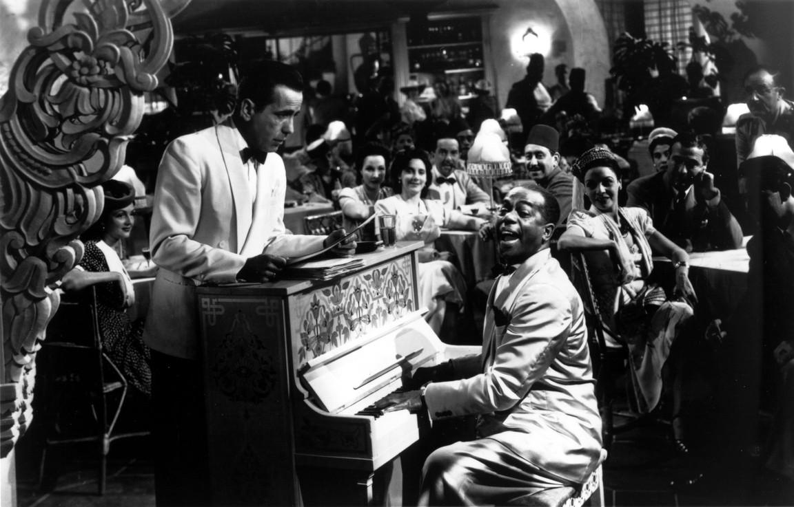 Rick’s Café Américain is a political no-man’s land for an exotic clientele. Rick (Humphrey Bogart, L) and Sam (Dooley Wilson) playing piano in "Casablanca." Warner Bros. (Fair Use)