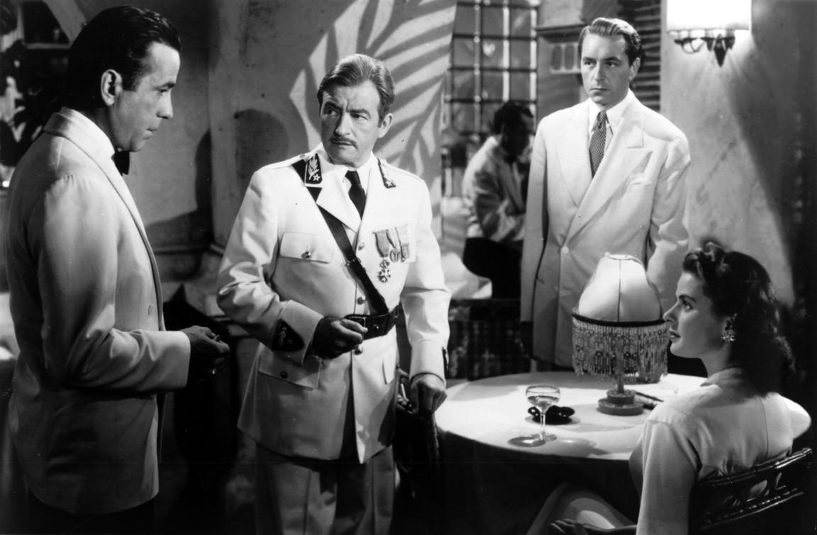 (L–R) Rick (Humphrey Bogart), Louis Renault (Claude Rains), Victor Laszlo (Paul Henreid), and Ilsa (Ingrid Bergman) in "Casablanca." Warner Bros. (Fair Use)