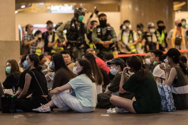 Riot police detain people after they cleared protesters taking part in a rally against a new national security law in Hong Kong on July 1, 2020. (Dale De La Rey/AFP via Getty Images)