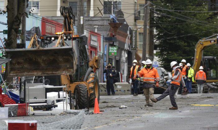 Photos: Police, City Workers Dismantle Seattle’s CHOP, Clear Out Protesters
