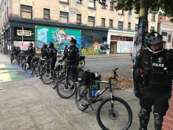 Seattle police block a street with their bicycles in the Capitol Hill Organized Protest zone early on July 1, 2020. (Aron Ranen/AP Photo)