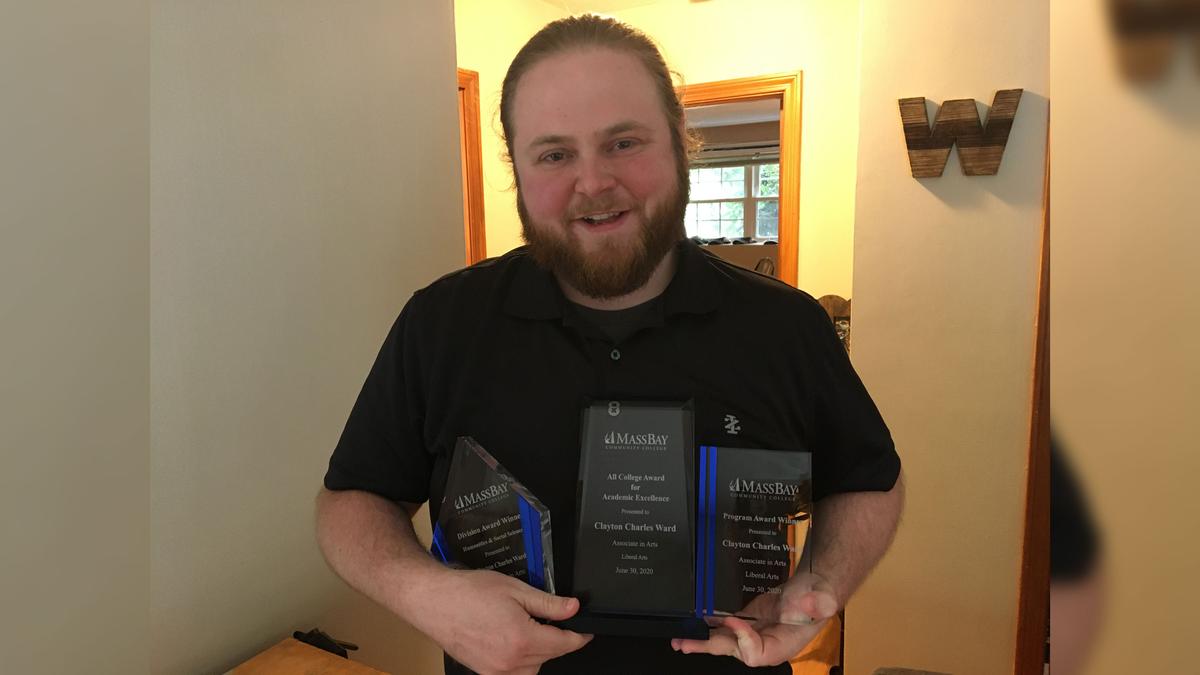 Clayton Ward with the awards he received at the commencement ceremony for his 4.0 GPA. (Courtesy of  MassBay Community College)