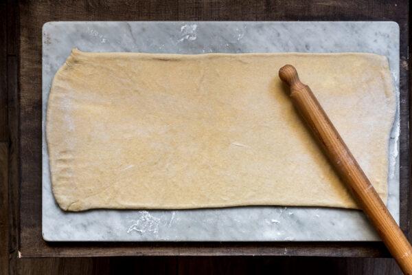 Roll out the dough to three times its length, keeping the same width. (Photo by Giulia Scarpaleggia)