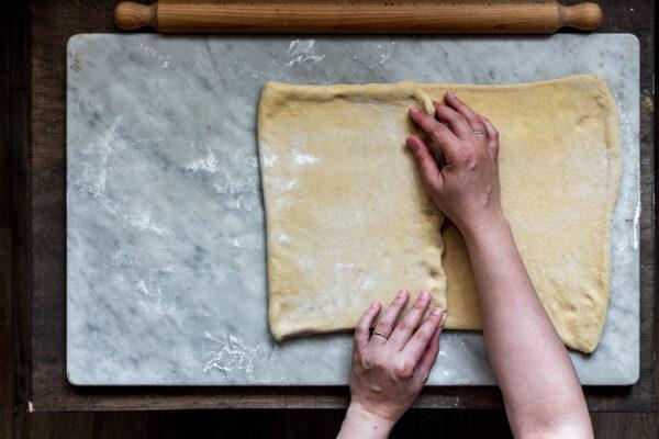 Fold the dough into thirds and pinch the edges to seal. (Photo by Giulia Scarpaleggia)