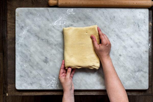 Fold the dough in half, like closing a book. (Photo by Giulia Scarpaleggia)