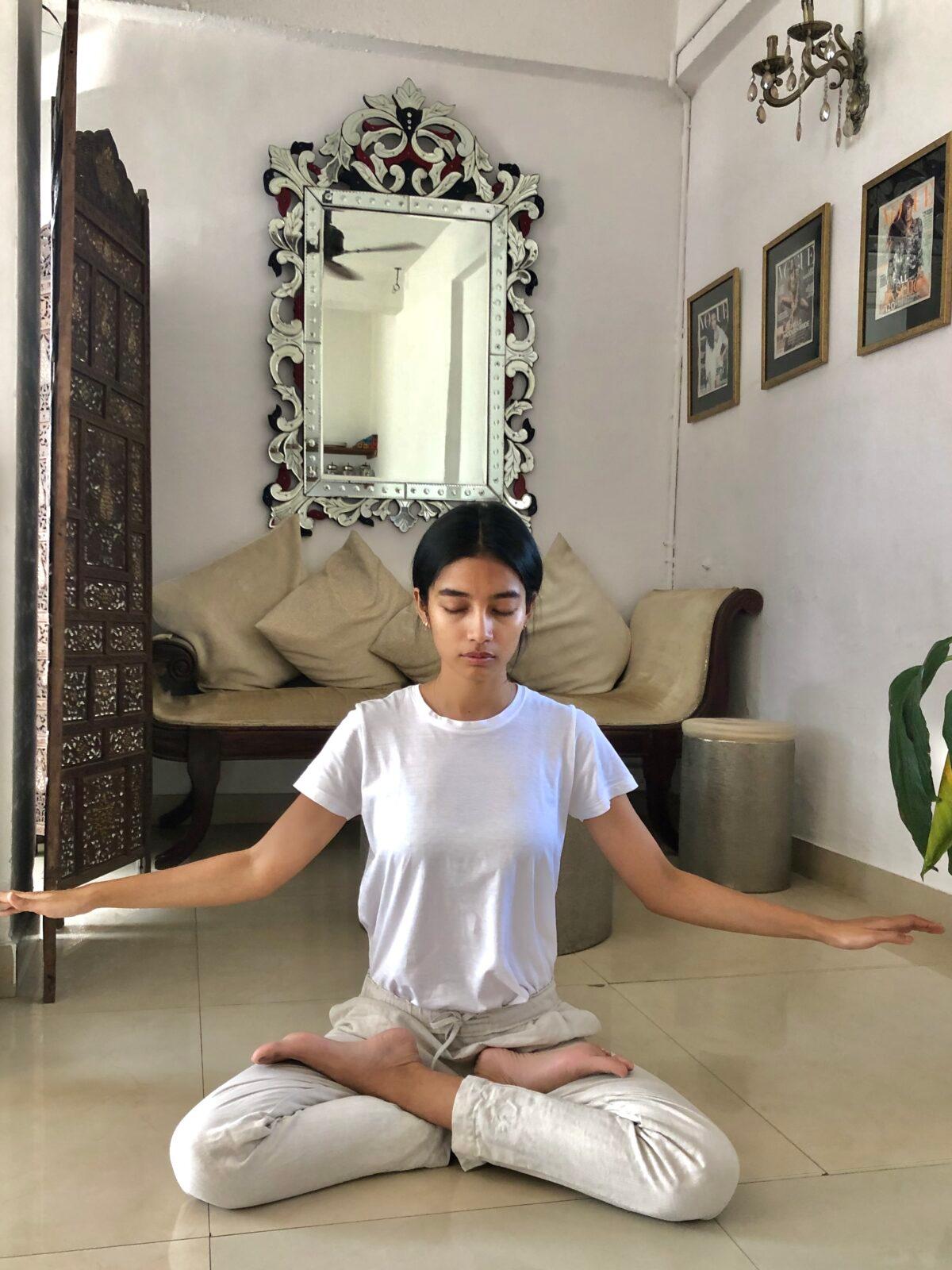  Sumaya Hazarika practicing the fifth set of Falun Gong exercises indoors. (Courtesy of Mark Luburic)