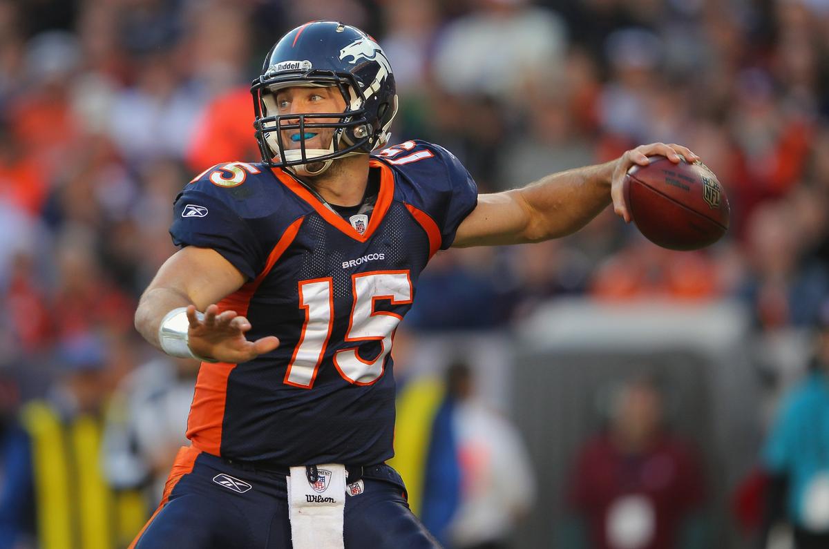 Tebow, former Denver Bronco, delivers a pass against the New England Patriots at Sports Authority Field at Mile High in Denver, Colorado, on Dec. 18, 2011. (Doug Pensinger/Getty Images)