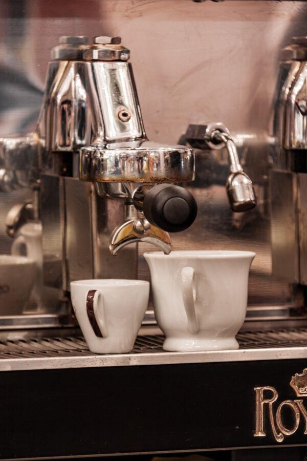 The shiny espresso machine churns out drink orders with precision and speed. (Photo by Giulia Scarpaleggia)