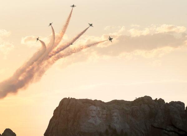 The U.S. Navy Blue Angels fly past Mount Rushmore National Monument ahead of a large fireworks display near Keystone, South Dakota, on July 3, 2020. (Scott Olson/Getty Images)