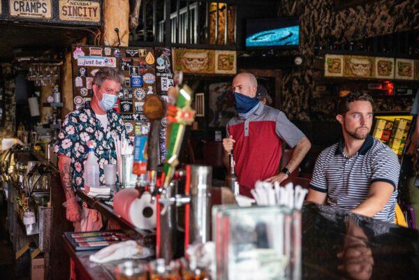 People sit at the bar of a restaurant in Austin, Texas, on June 26, 2020. (Sergio Flores/AFP/Getty Images)