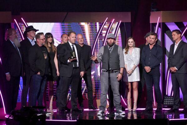 Film editor Andrew Erwin accepts an award onstage with the cast and crew of "I Can Only Imagine" during the sixth Annual KLOVE Fan Awards at The Grand Ole Opry on May 27, 2018, in Nashville, Tenn. (Jason Davis/Getty Images for KLOVE)