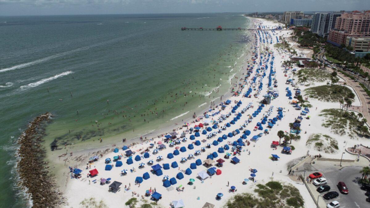Sun seekers gather at Clearwater Beach in Clearwater, Fla., on July 4, 2020. (Drone Base/Reuters)