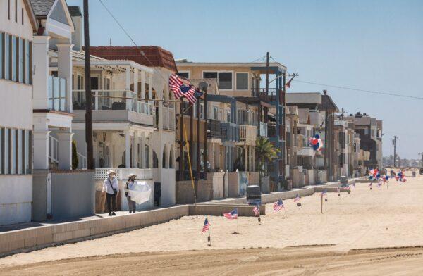 American flags line the boardwalk in Seal Beach, Calif., on July 4, 2020. (John Fredricks/The Epoch Times)