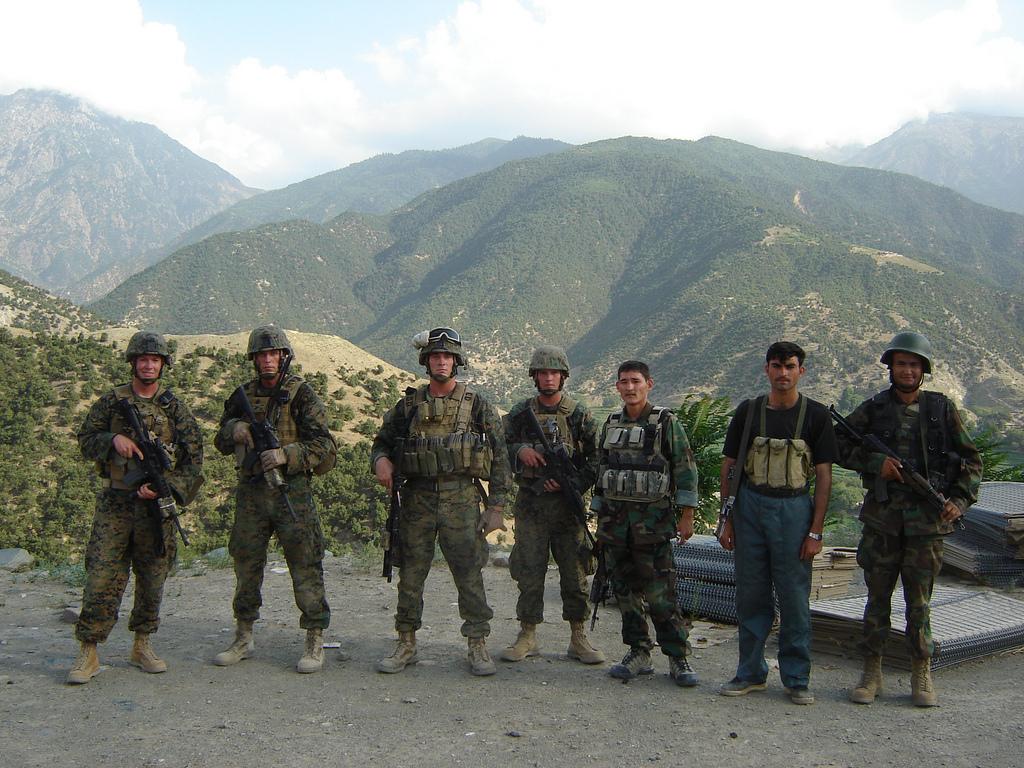 (From left to right) HM3 James Leyton, Gunnery Sgt. Aaron Kenefick, 1st Lt. Michael Johnson, and Sgt. Dakota Meyer with Afghan National Army members in Afghanistan, in support of Operation Enduring Freedom (<a href="https://www.dvidshub.net/image/442326/sgt-dakota-meyer">DVIDSHUB</a>)